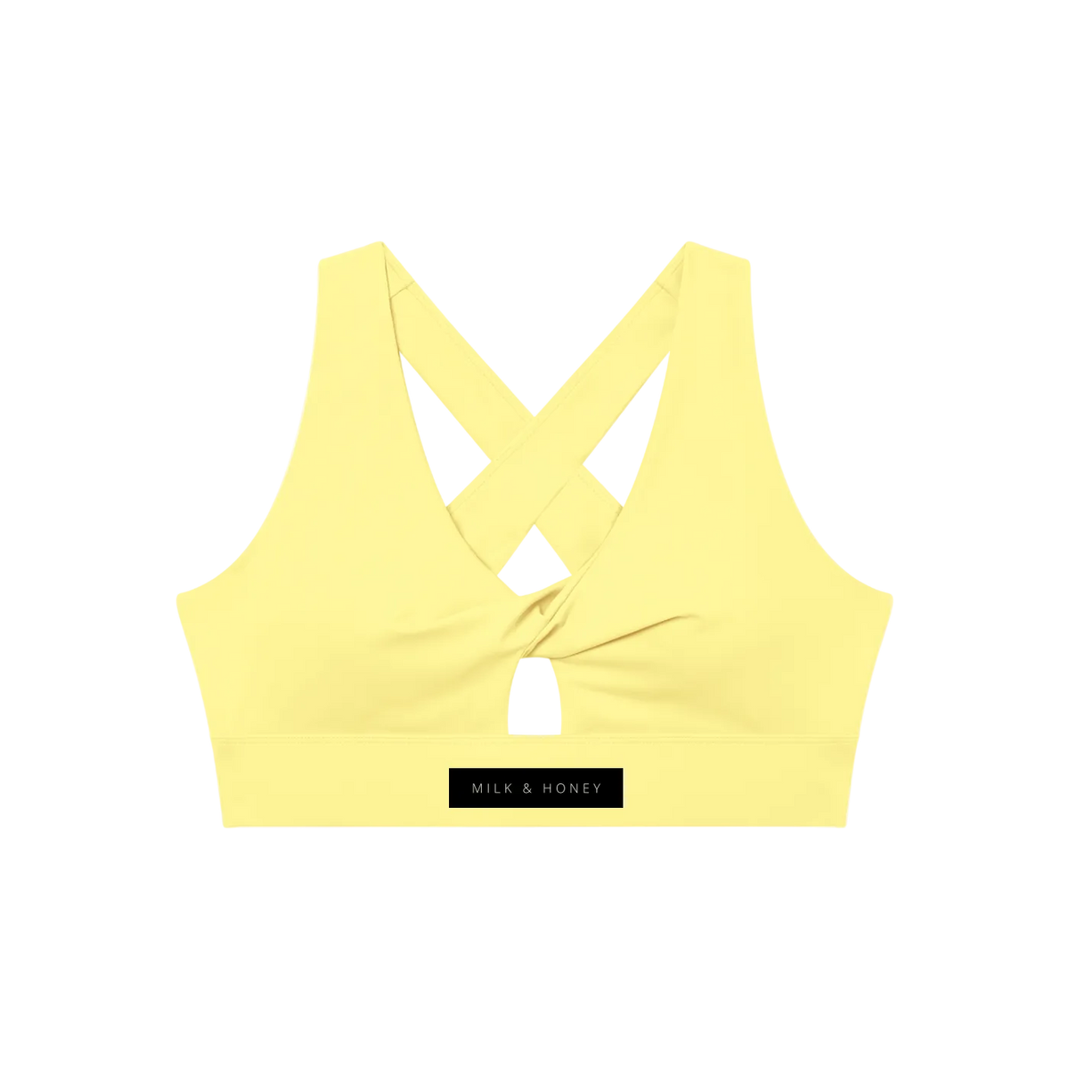 Pale yellow V-neck sports bra with twist front, small keyhole and crossed back straps; 'MILK & HONEY' logo on the band