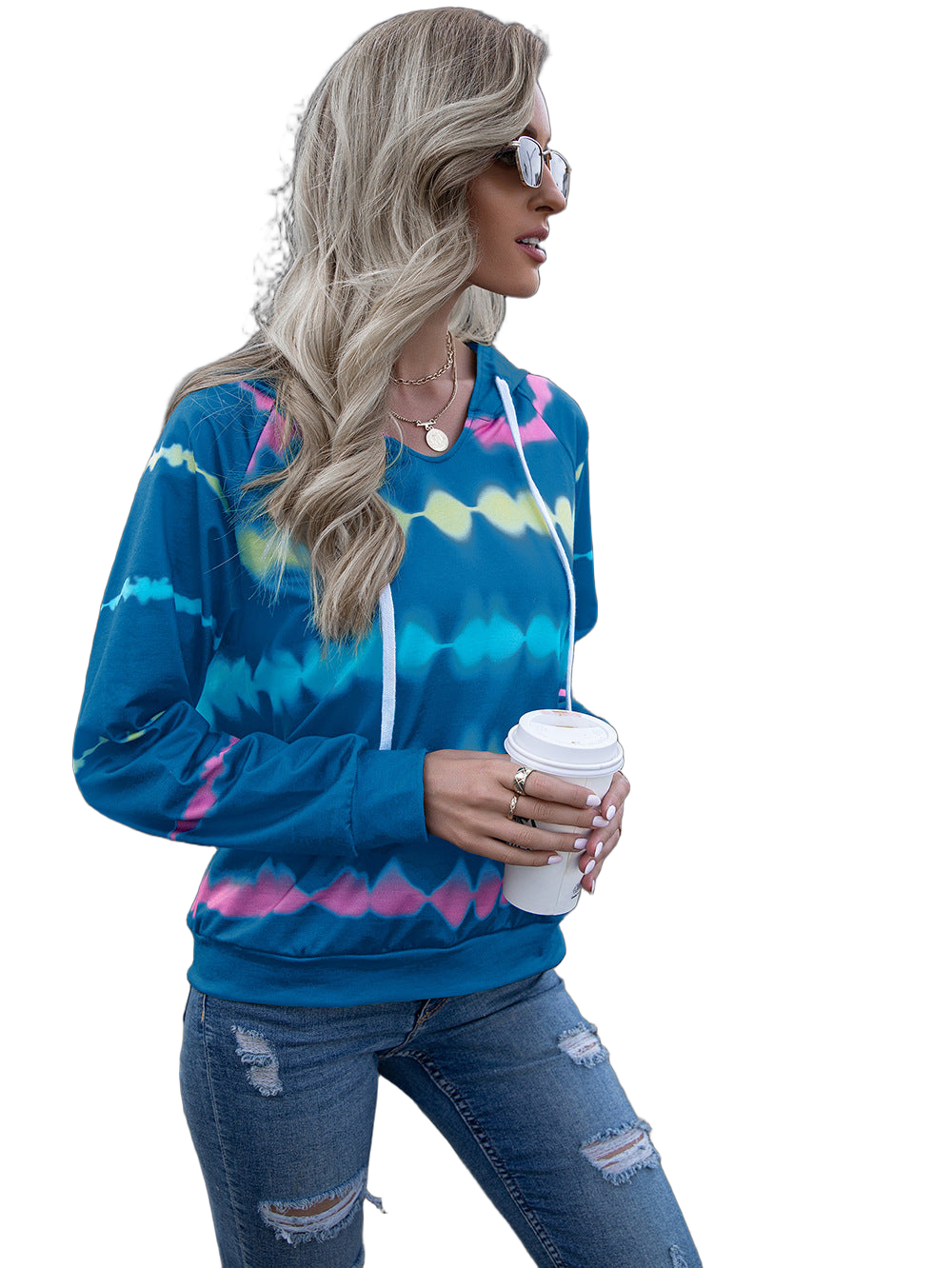 Model wearing sky-blue tie-dye hooded sweatshirt with raglan sleeves and white drawstrings, holding a takeaway coffee cup…