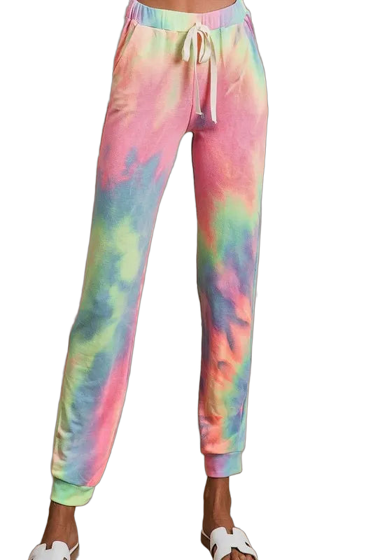 Pastel tie-dye French terry jogger pants with drawstring waist, side pockets and cuffed ankles, model wearing white slide…