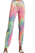 Pastel tie-dye French terry jogger pants with drawstring waist, side pockets and cuffed ankles, model wearing white slide…