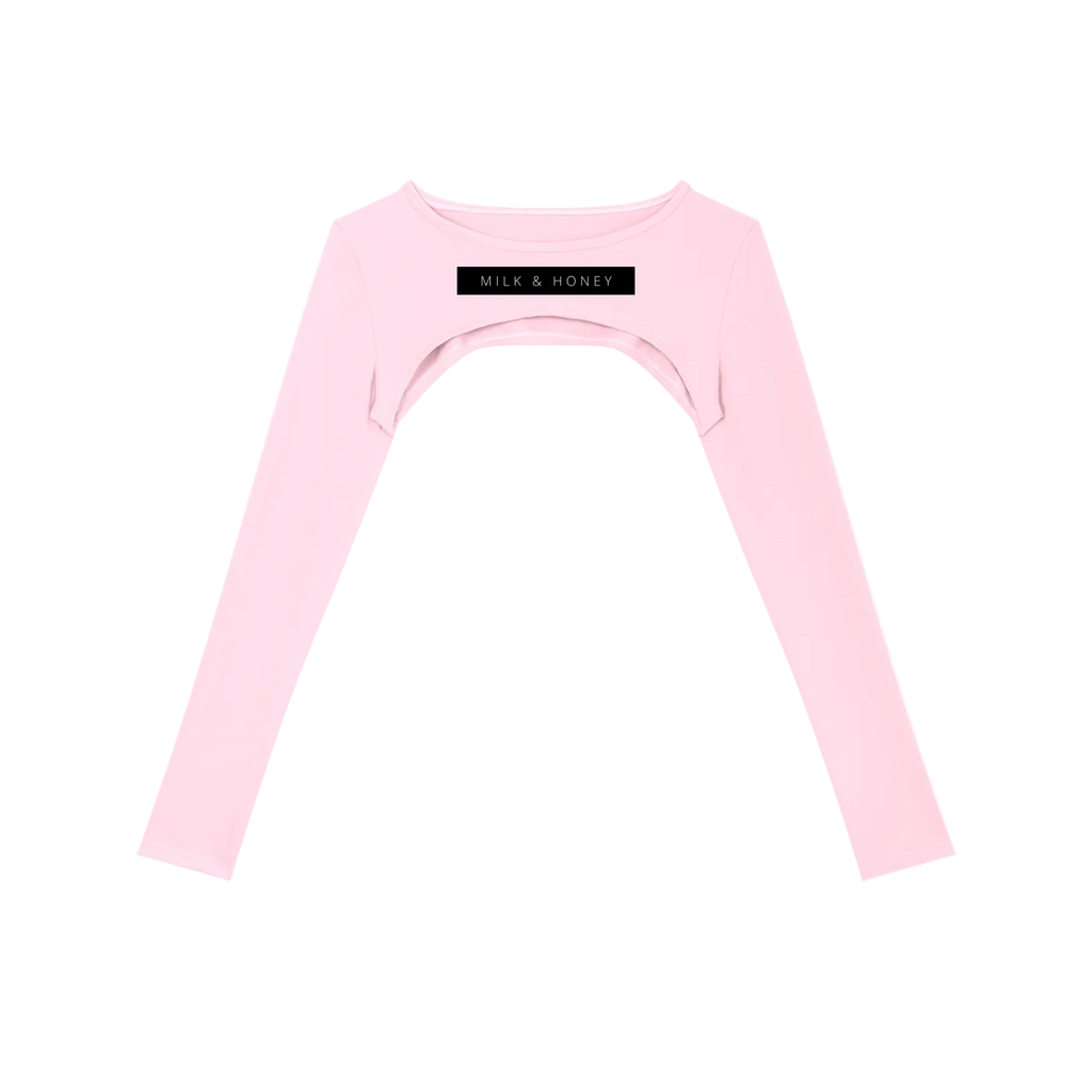 Pale pink long-sleeve cropped shrug with chest cutout and black 'MILK & HONEY' label
