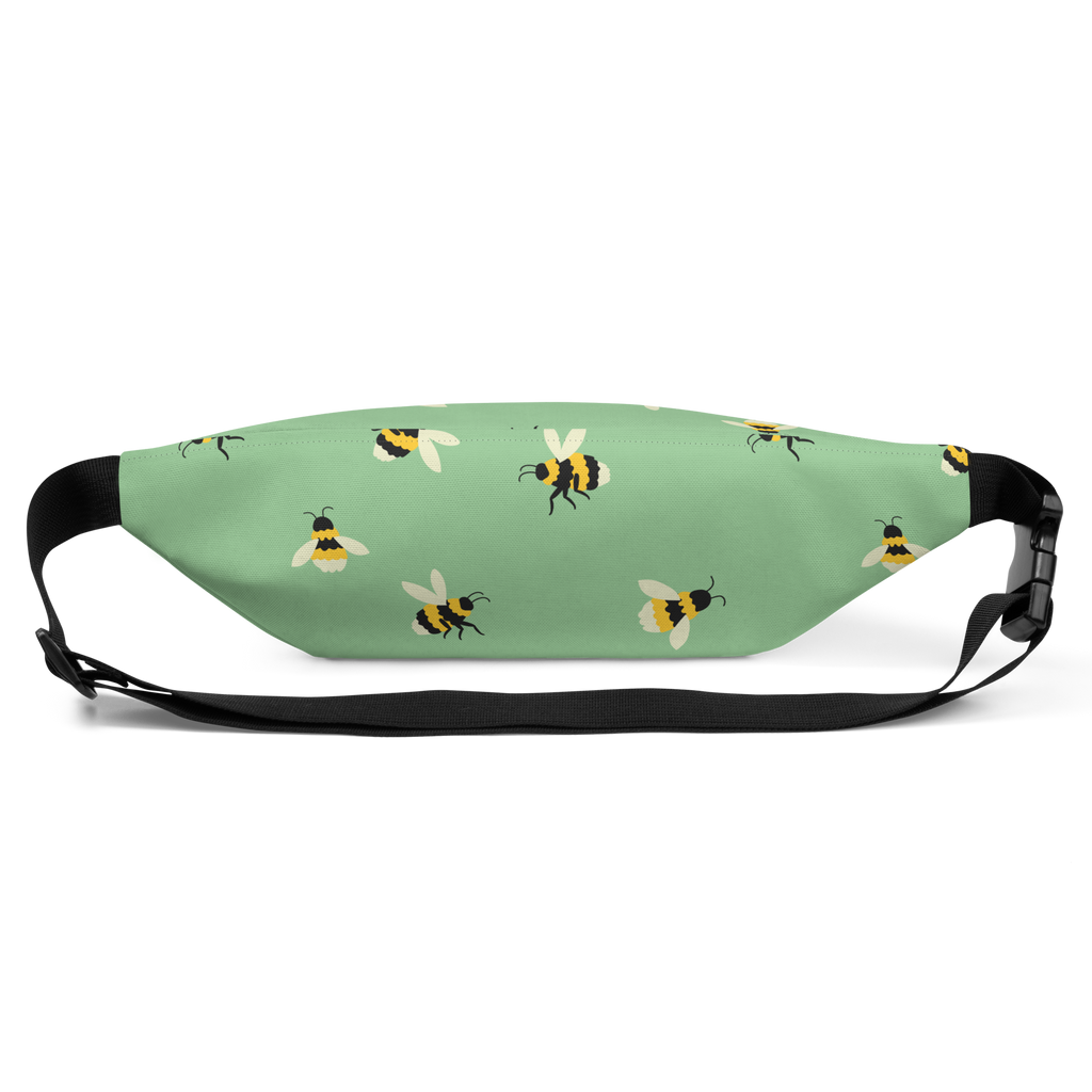 Mint green waist bag with repeating bee illustrations, black adjustable strap and plastic side buckle.