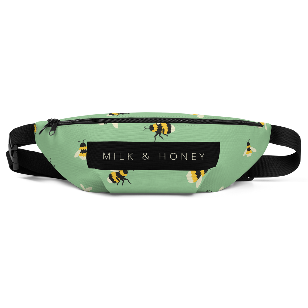 Mint-green waist bag with bee pattern, black zipper, 'MILK & HONEY' label and adjustable black strap