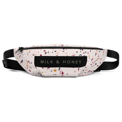 Top view of terrazzo-pattern fanny pack with black zipper, dual sliders, MILK & HONEY label and adjustable black straps