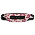 Top of waist bag with black zipper, "MILK & HONEY" label, pink spot print on light fabric and black adjustable strap
