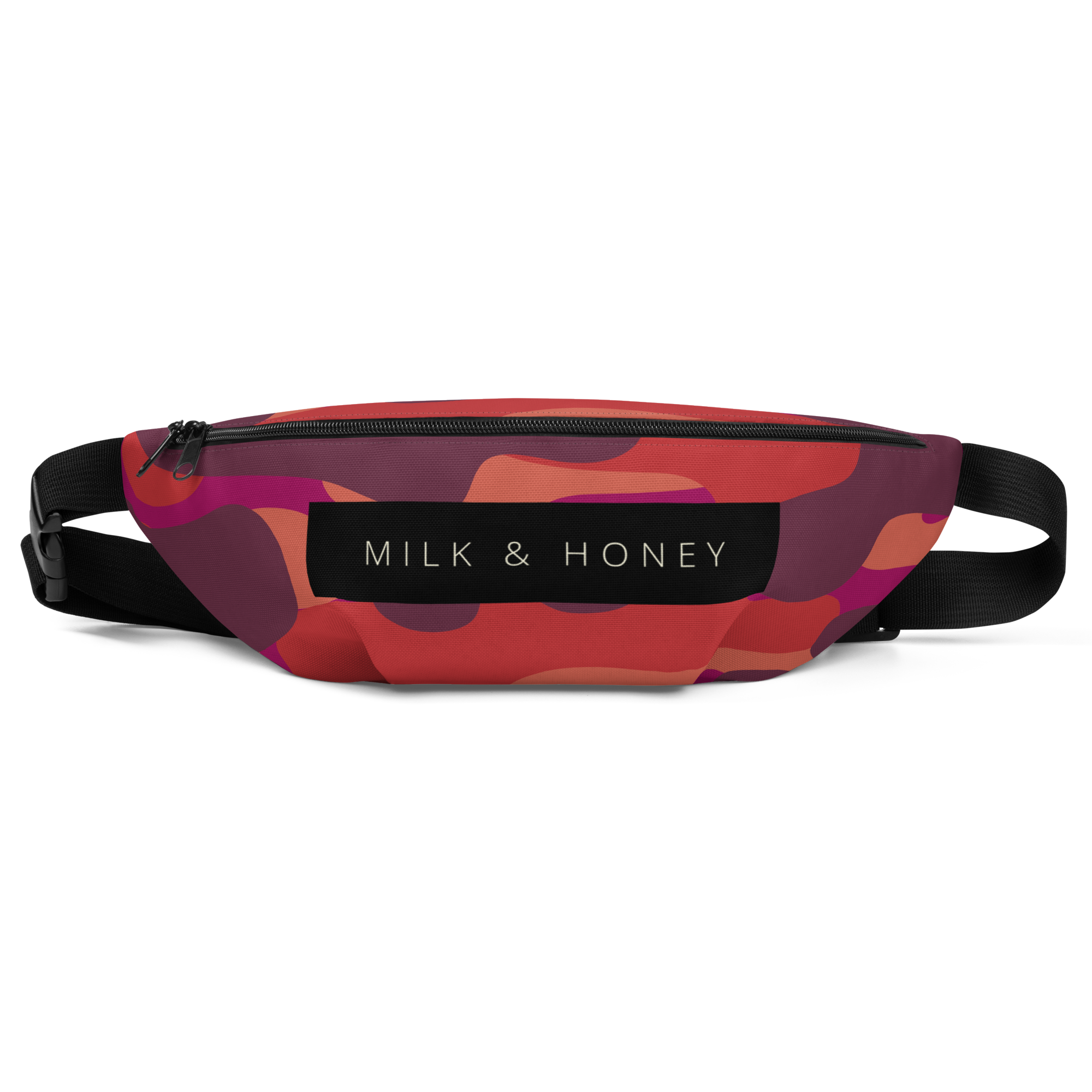 Zippered top of fanny pack with black 'MILK & HONEY' label, abstract red-orange-purple print, and adjustable black strap