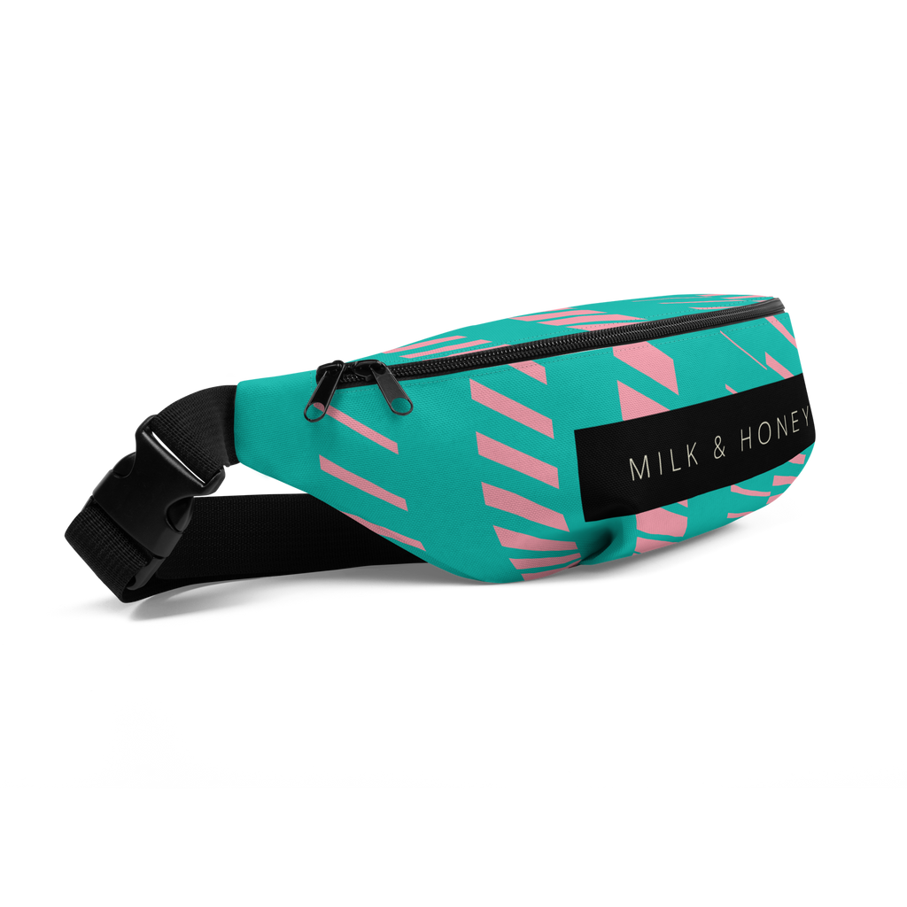 Turquoise fanny pack with pink geometric stripes, black dual-zipper pulls, black strap and plastic buckle; 'MILK & HONEY'…
