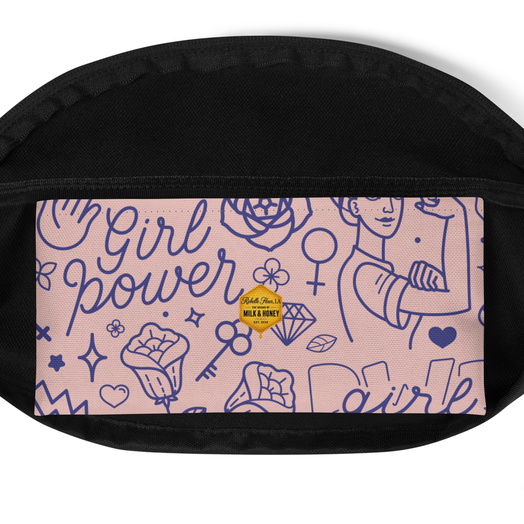 Black textured fanny pack edges with pink front panel showing blue line-drawn Girl Power doodles and a small gold hexagon…
