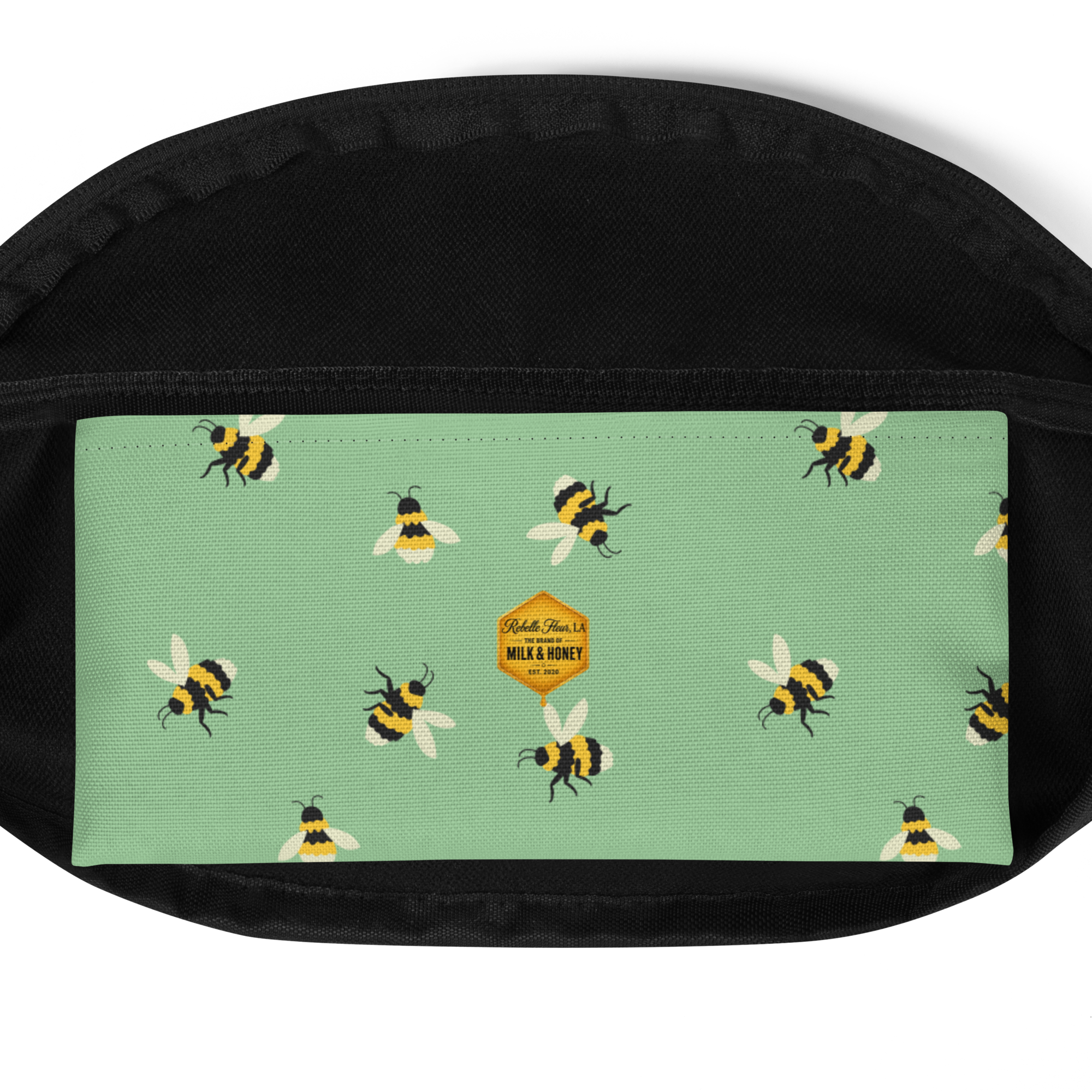 Fanny pack front panel with mint green bee print and small hexagon 'Milk & Honey' label; black fabric trim