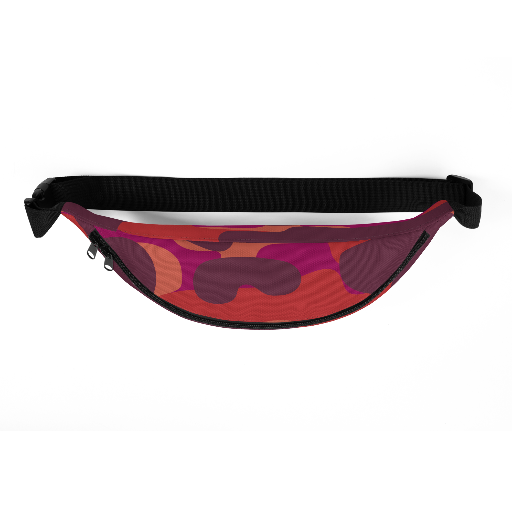 Black adjustable strap and buckle above a red, pink and purple abstract-patterned fanny pack with top zipper and two sliders