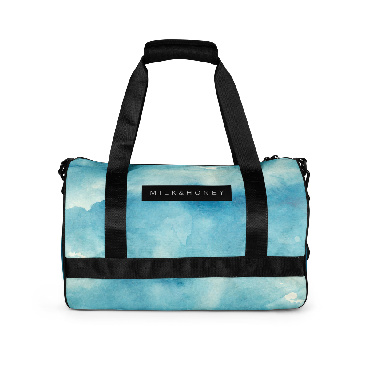 Black padded dual handles and straps over aqua watercolor gym bag with MILK&HONEY label