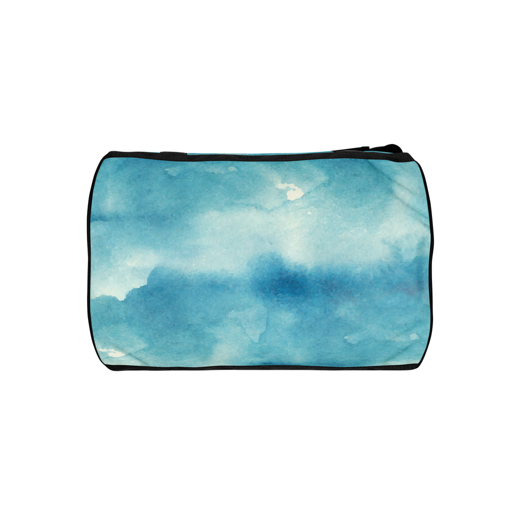 Top of gym bag with blue watercolor cloud print, black piping and black handles visible