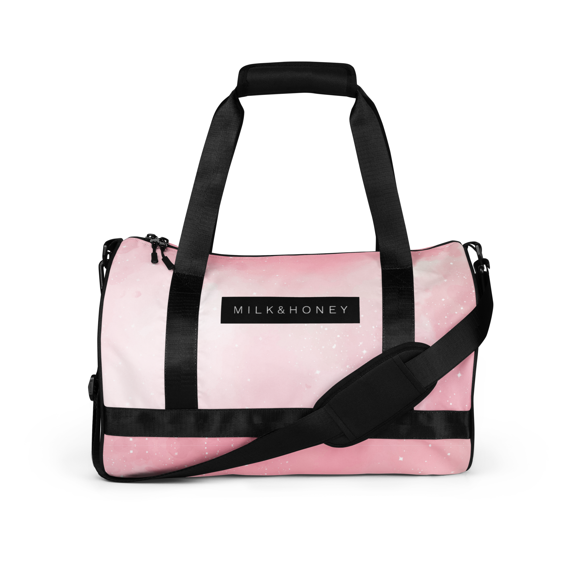 Pink duffel with black padded top handles, adjustable shoulder strap, and rectangular 'MILK&HONEY' logo on front