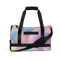 Pastel gradient duffel with black padded carry handles, adjustable shoulder strap, zipper pulls, and MILK&HONEY label