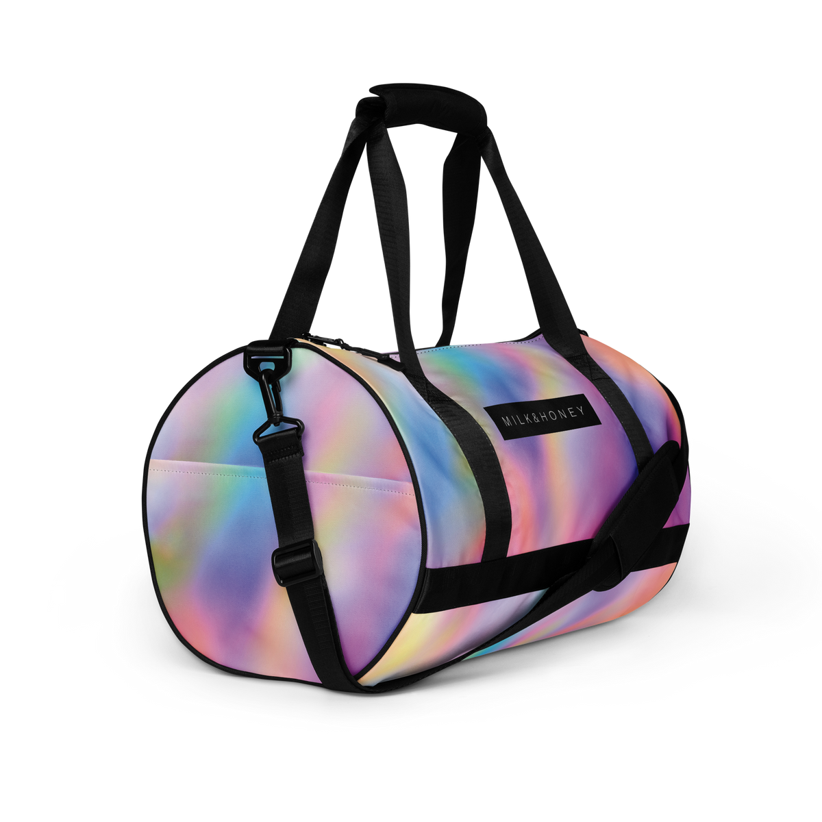 Rounded duffel bag with iridescent pastel finish, black padded handles and straps, metal swivel clip, visible 'MILK&HONEY'…