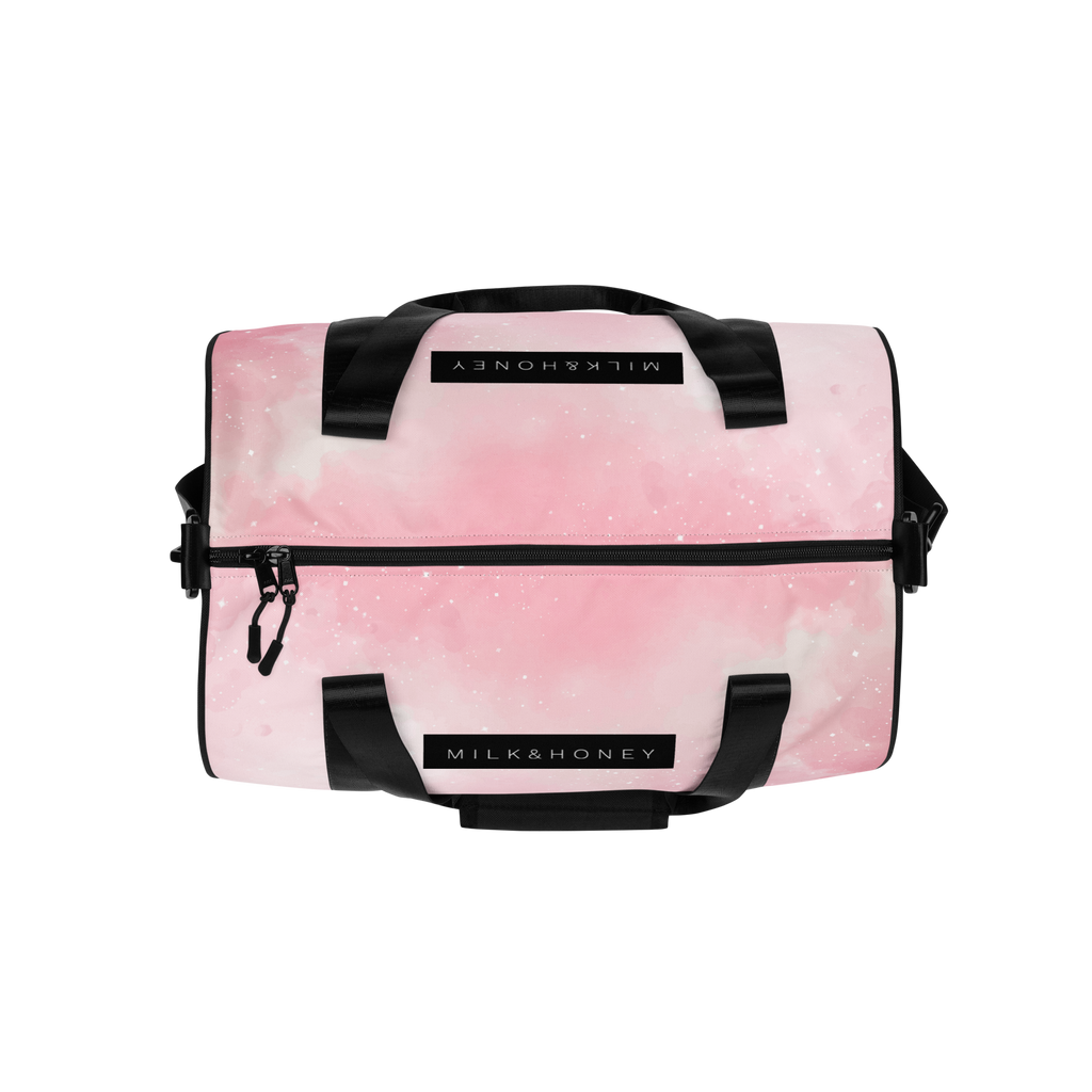 Pink watercolor gym bag top with black padded handles, black zipper and piping, showing a 'MILK&HONEY' label