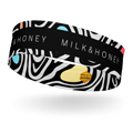 Black headband with white zebra swirls, MILK & HONEY text, blue and yellow accent shapes and small hexagon brand label