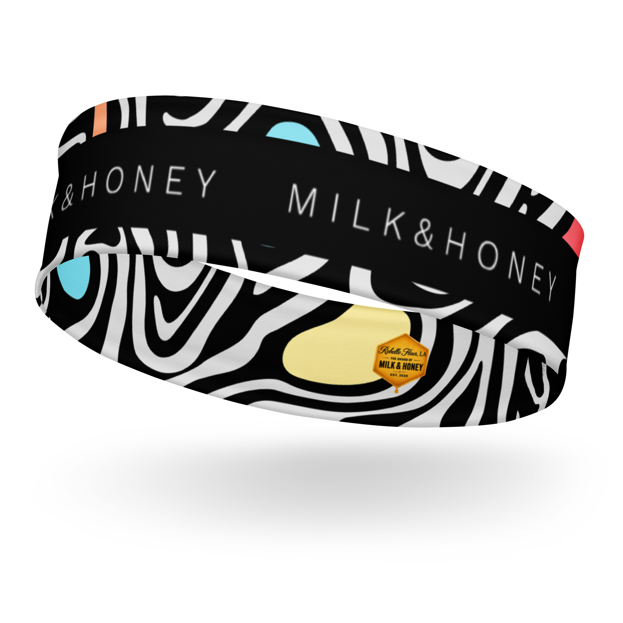 Black headband with white zebra swirls, MILK & HONEY text, blue and yellow accent shapes and small hexagon brand label
