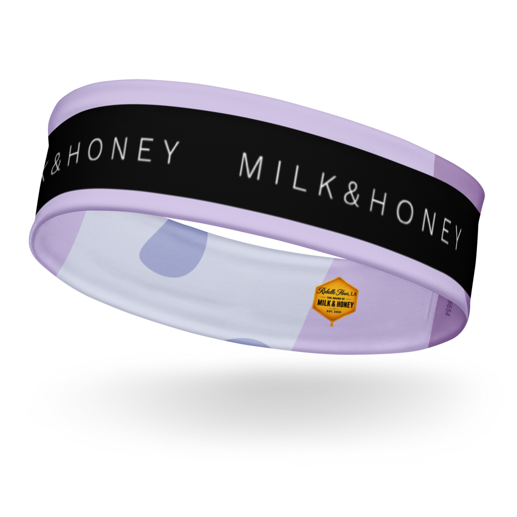 Lavender headband with black band reading 'MILK & HONEY', pale dot pattern and small hexagon Rebelle Fleur logo