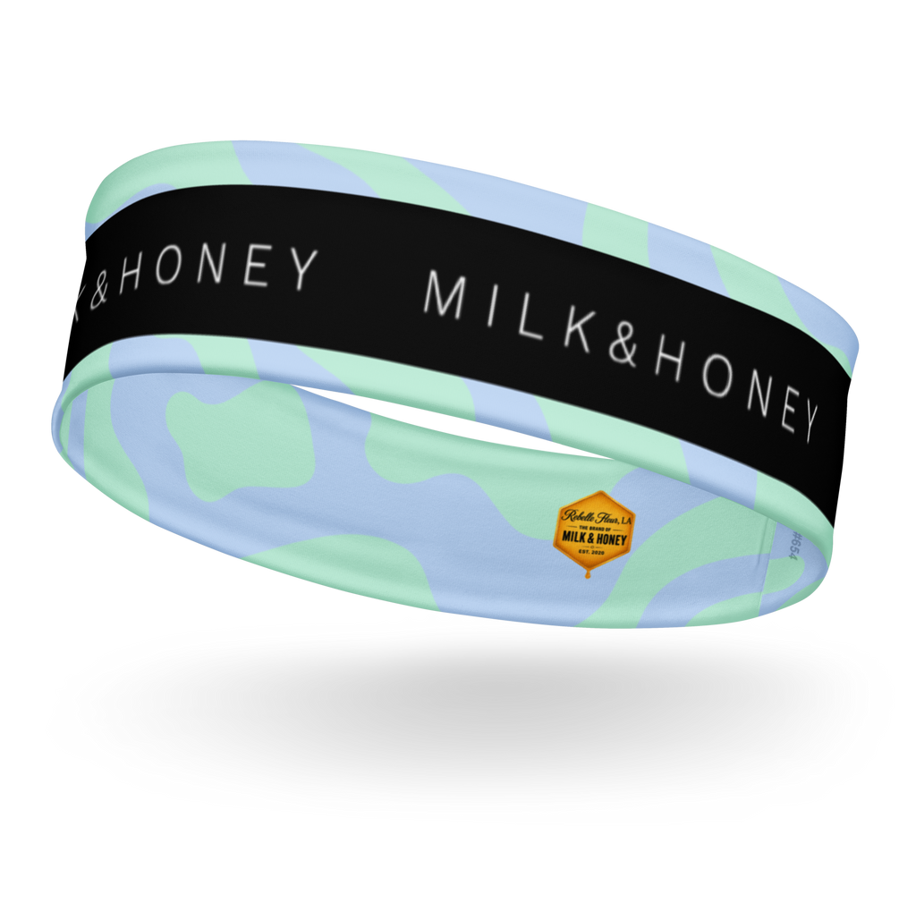 Stretch headband with black 'MILK & HONEY' band, mint green and pale blue abstract print and small hexagon Rebelle Fleur…