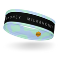 Stretch headband with black 'MILK & HONEY' band, mint green and pale blue abstract print and small hexagon Rebelle Fleur…