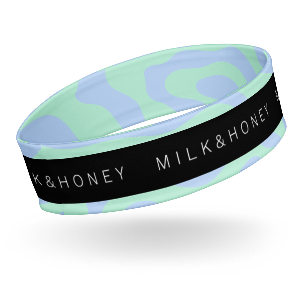 Wide headband with mint and light-blue wavy pattern and black band showing white 'MILK & HONEY' text