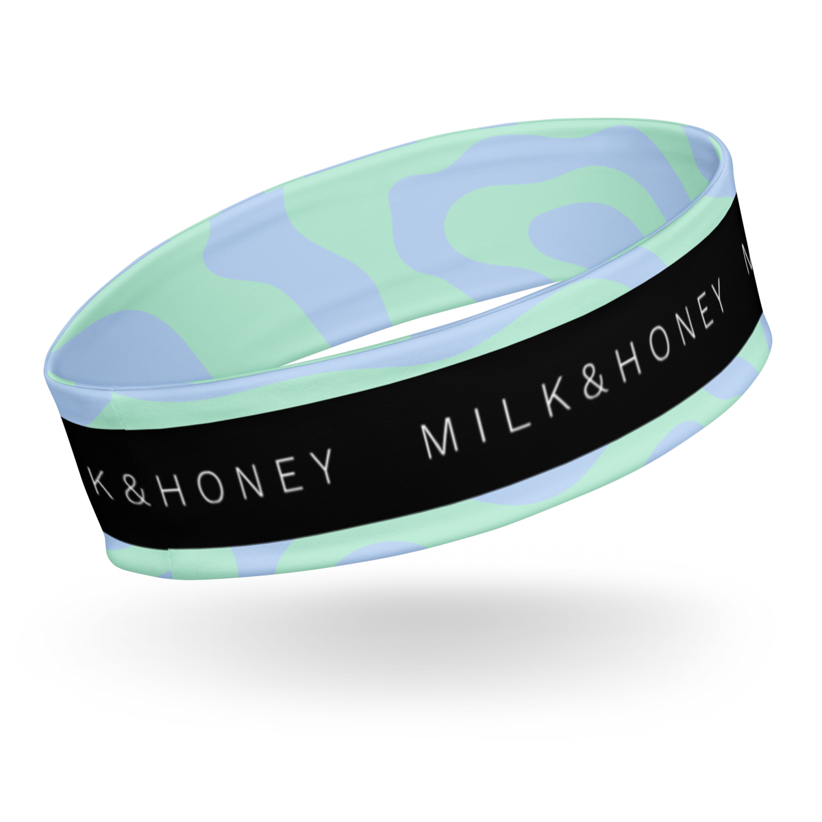 Wide headband with mint and light-blue wavy pattern and black band showing white 'MILK & HONEY' text