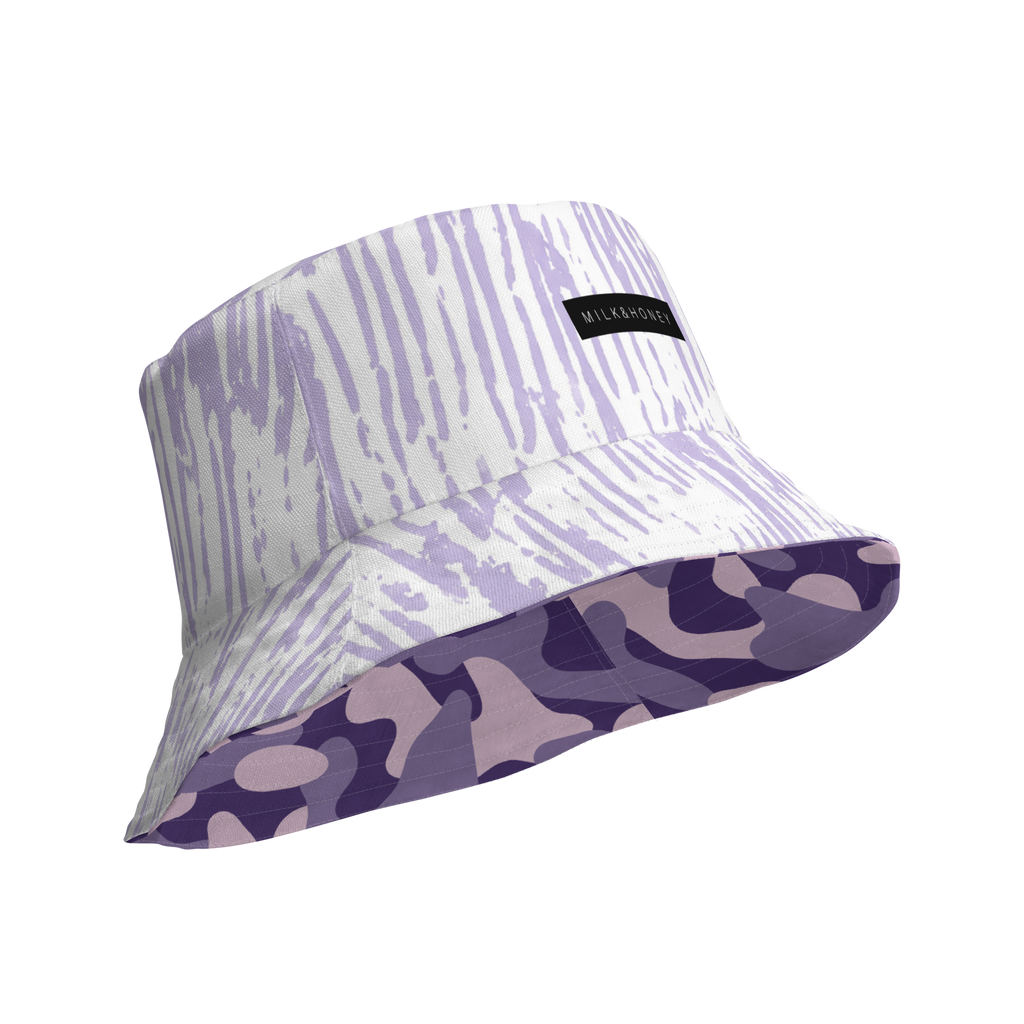 Bucket hat with light purple streak print, black 'MILK&HONEY' label and reversed brim showing purple camouflage pattern