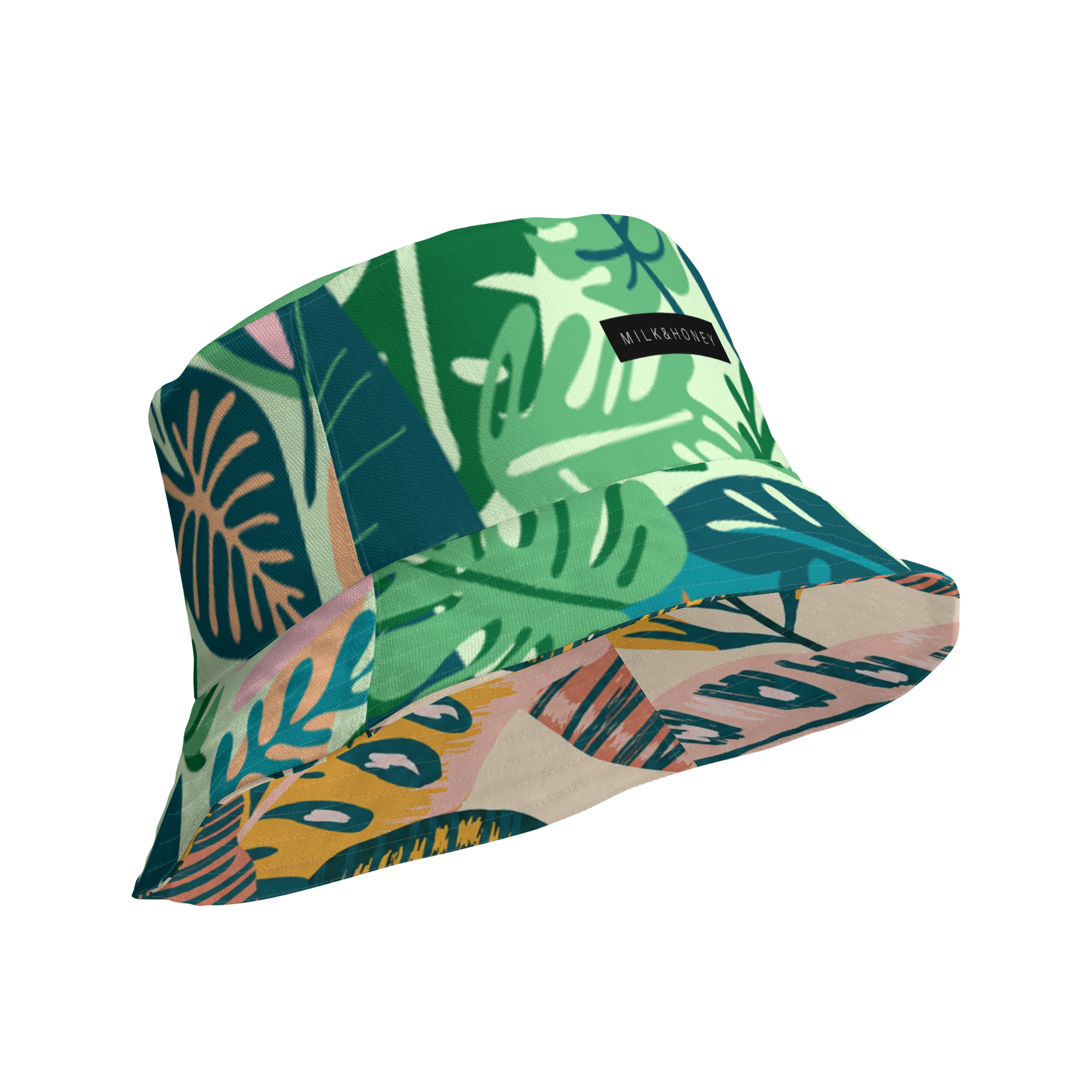 Reversible bucket hat with green tropical leaf print and black MILK&HONEY label