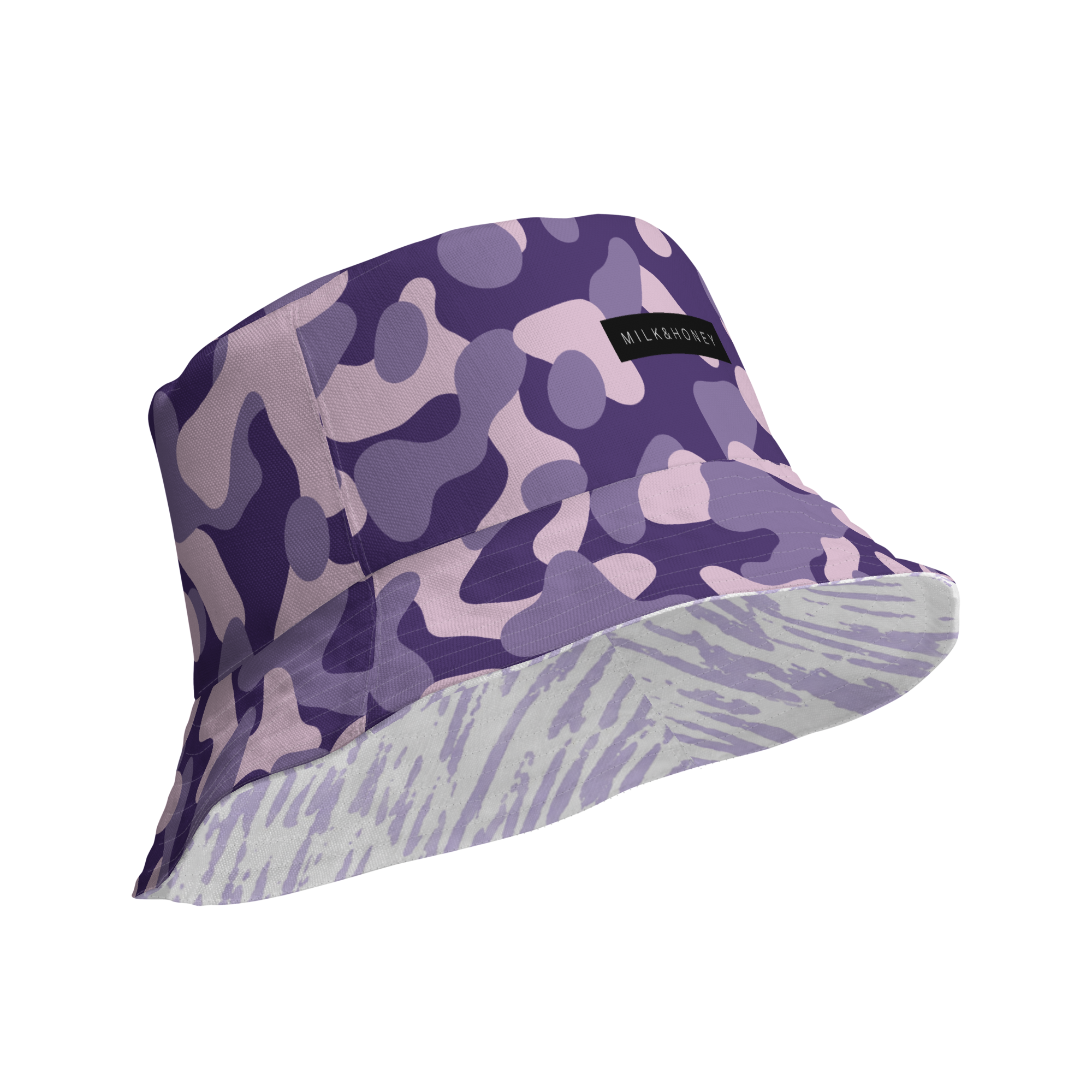 Purple and lavender camouflage bucket hat showing tiger-stripe underbrim and black MILK&HONEY label.
