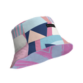 Pastel geometric patchwork bucket hat with stripes, triangles and a black 'MILK&HONEY' fabric label