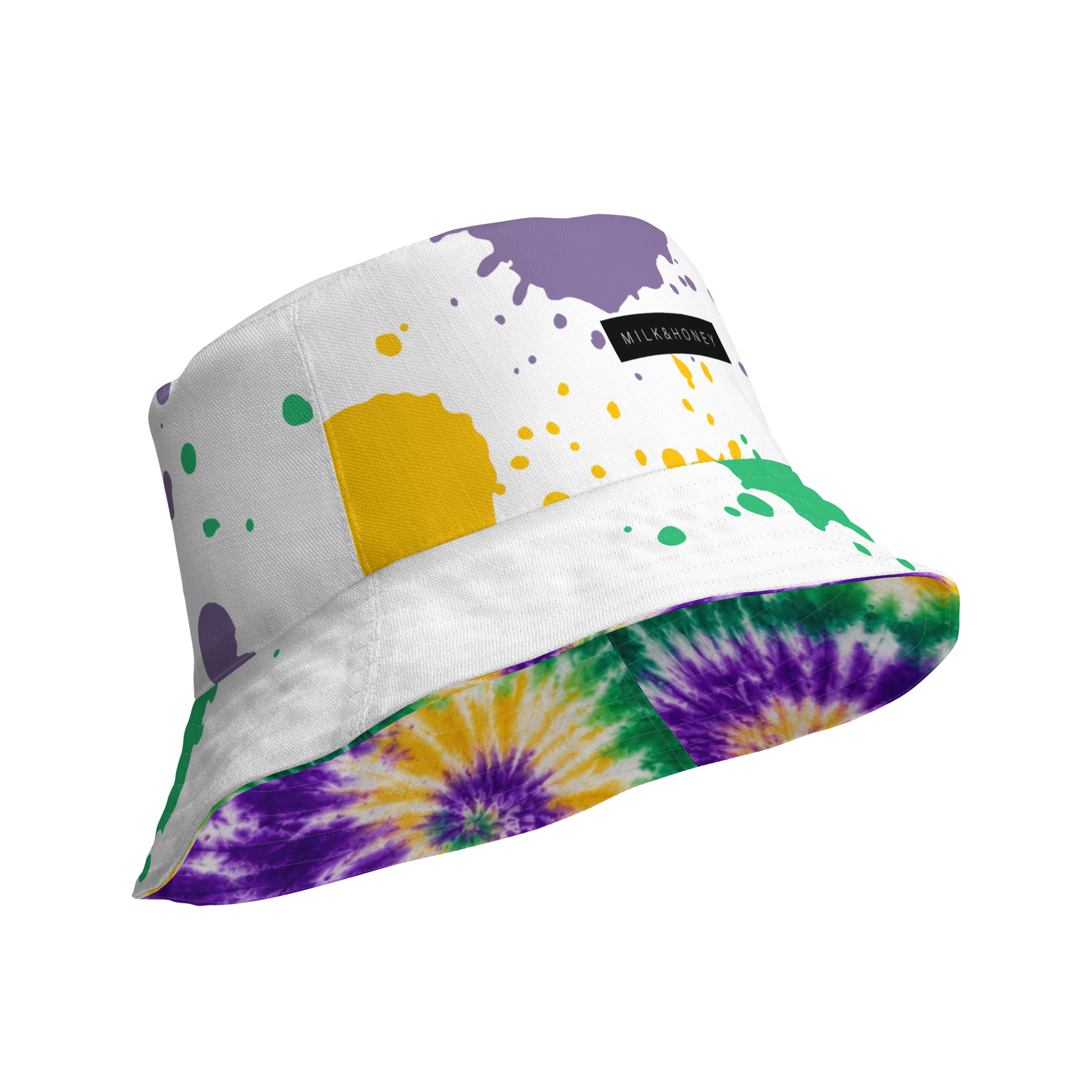 White bucket hat with purple, yellow and green paint-splatter print, black MILK&HONEY label and tie-dye underside