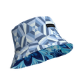 Bucket hat with geometric blue pattern, visible MILK&HONEY label and contrasting floral blue underside.