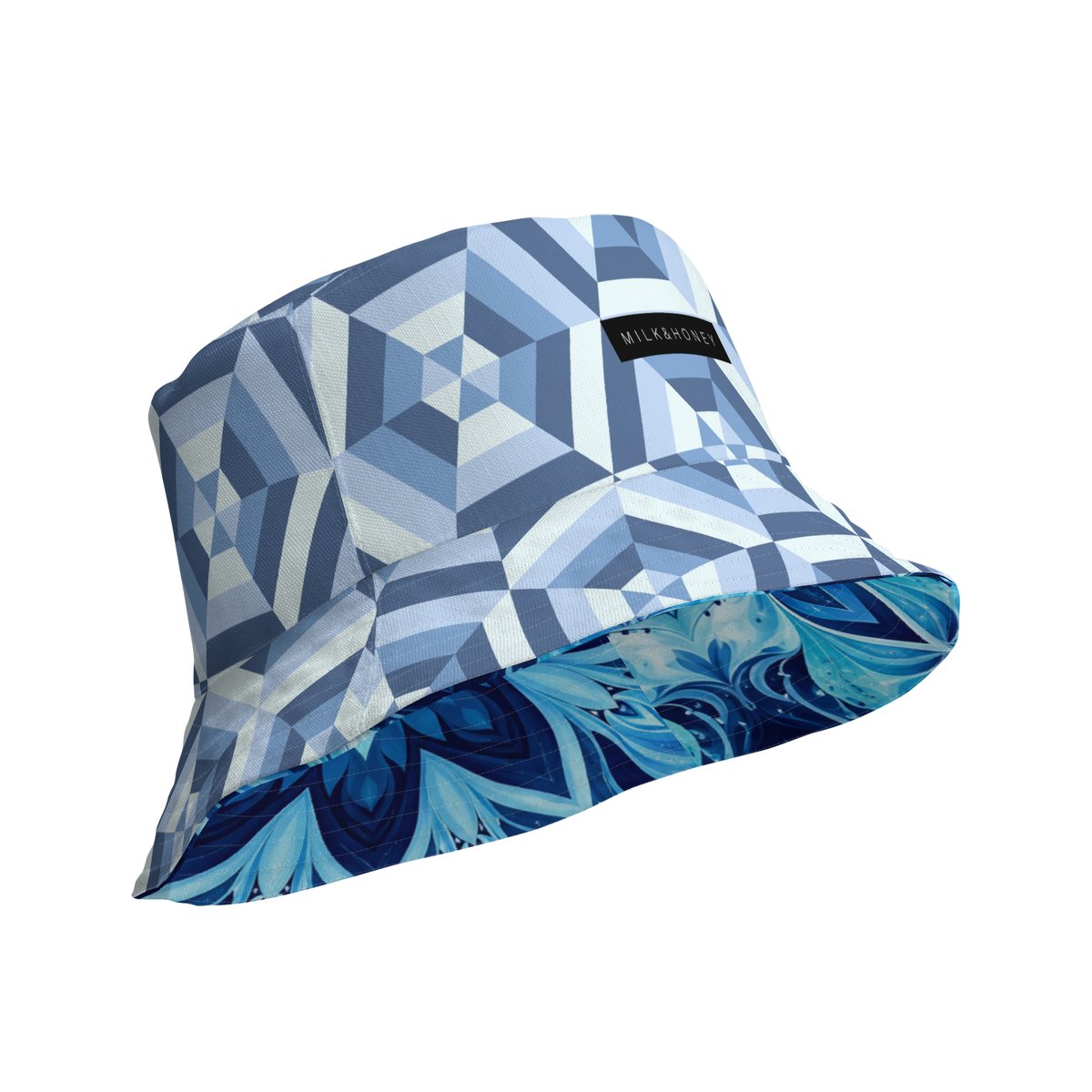 Bucket hat with geometric blue pattern, visible MILK&HONEY label and contrasting floral blue underside.