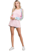 Blush jersey top with pastel tie-dye laser-cut slit sleeves, crew neckline, long tunic hem over denim shorts