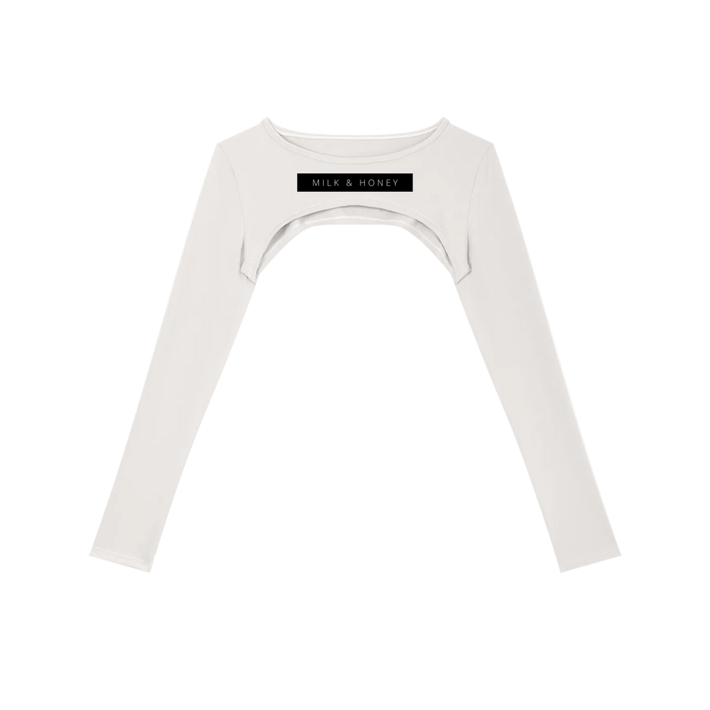 Off-white cropped long-sleeve shrug with round neck, underbust crescent cutout and black rectangular 'MILK & HONEY' chest…