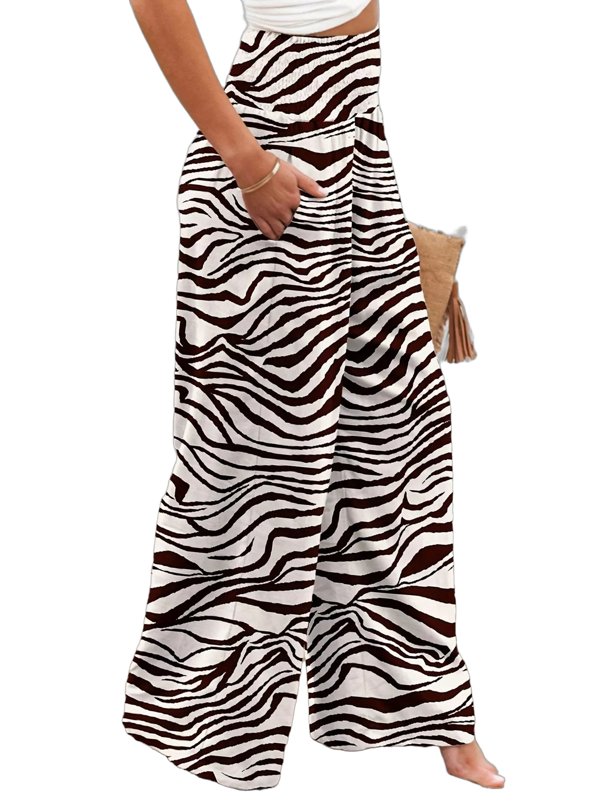 High-waist zebra-print wide-leg pants with side pocket and elasticized waistband, model's hand in pocket