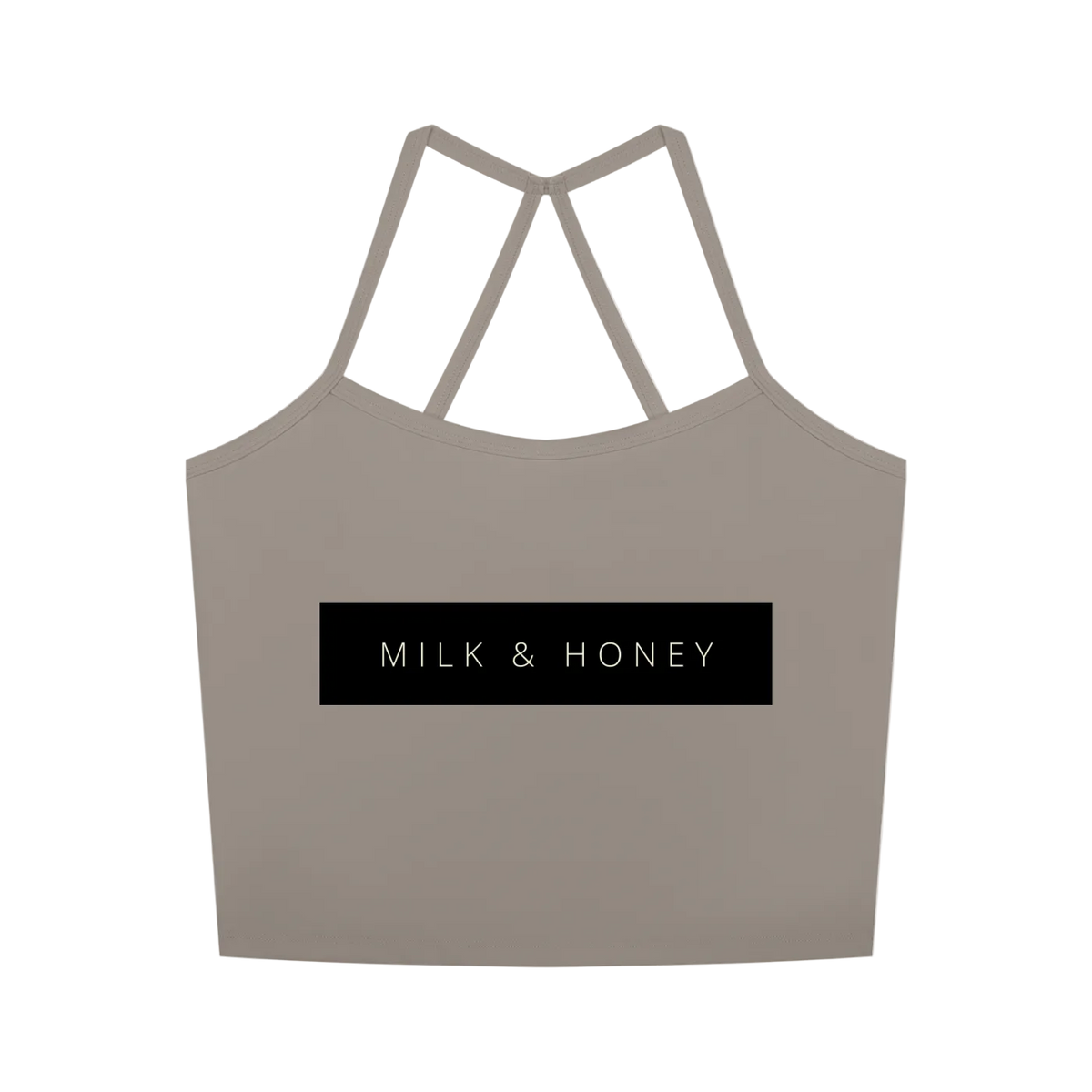 Sleeveless cropped tank with double V-back straps and centered black rectangle reading 'MILK & HONEY'