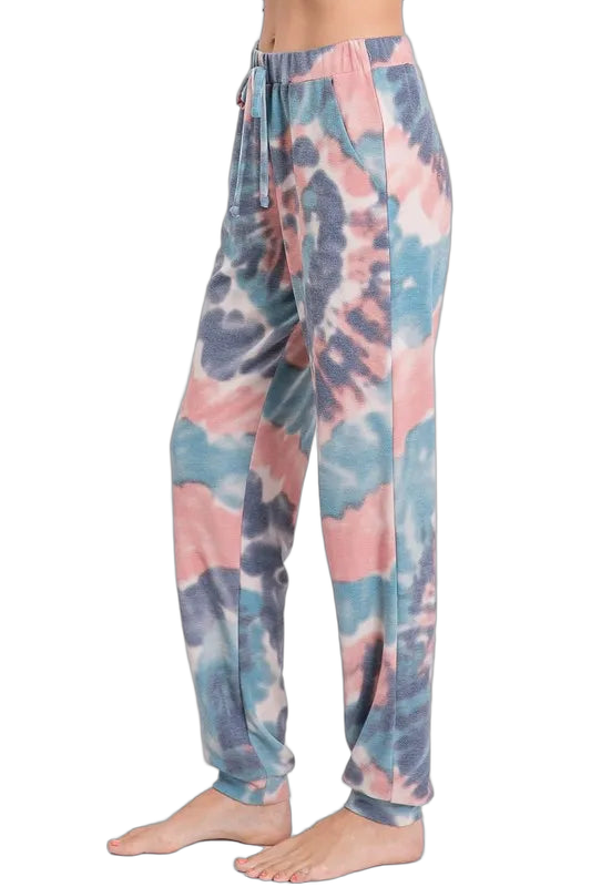 Tie-dye lounge pants in pastel pink, blue, and gray with elastic waistband, drawstring and side pockets