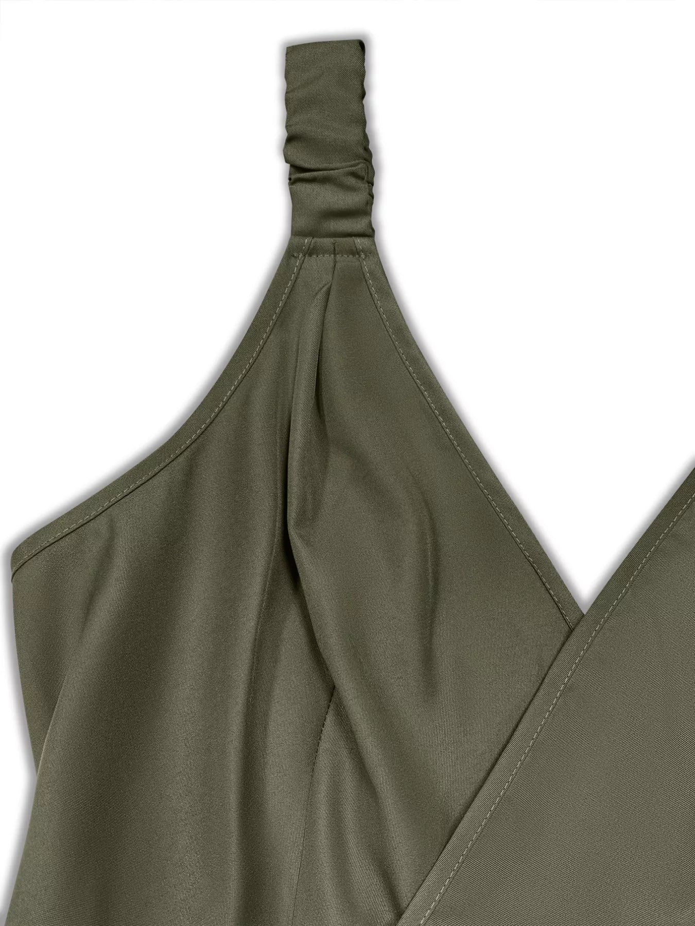 Olive-green fabric close-up showing a ruched shoulder strap and crossover V-neck with stitched seams