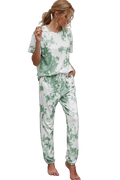 Model wearing green-and-white tie-dye short-sleeve tee and drawstring waist joggers with side pockets