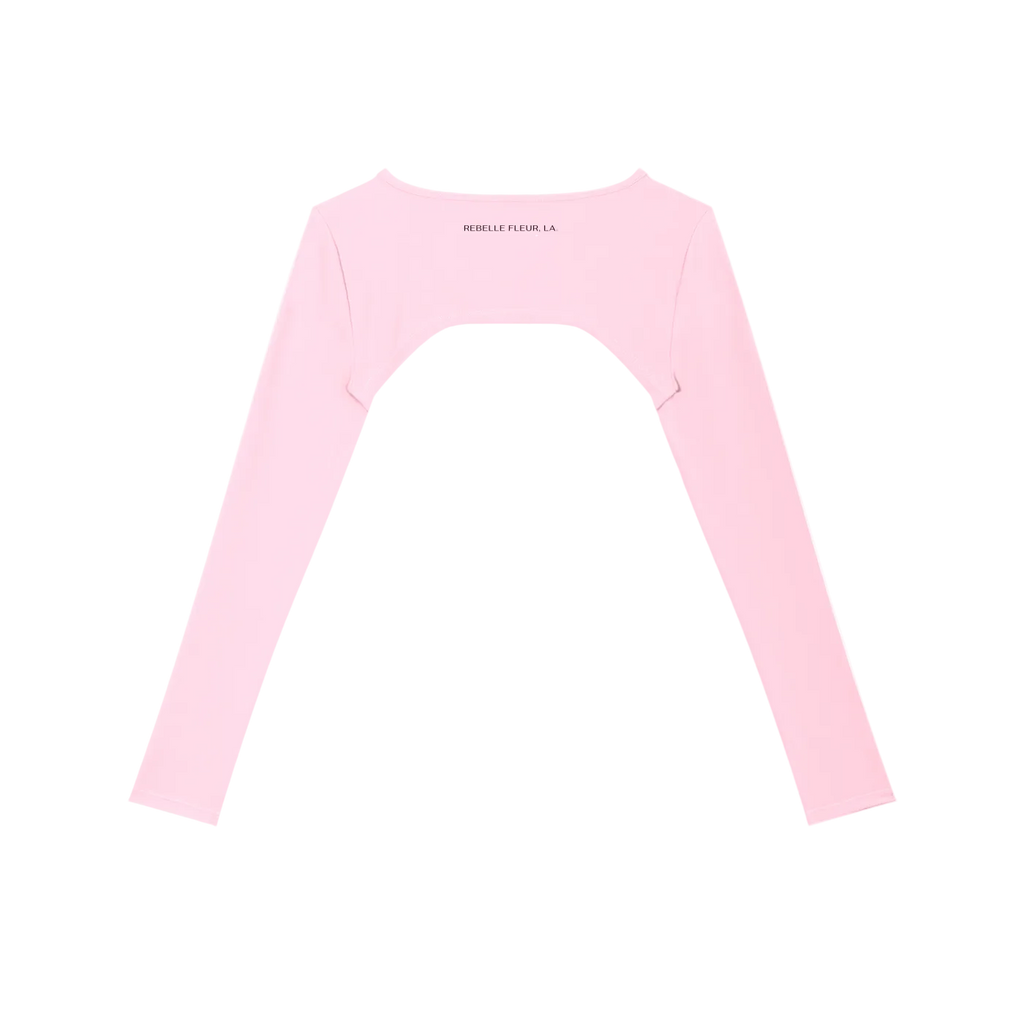 Light pink cropped long-sleeve shrug with large back cutout, boat neckline and small 'REBELLE FLEUR, LA.' printed label