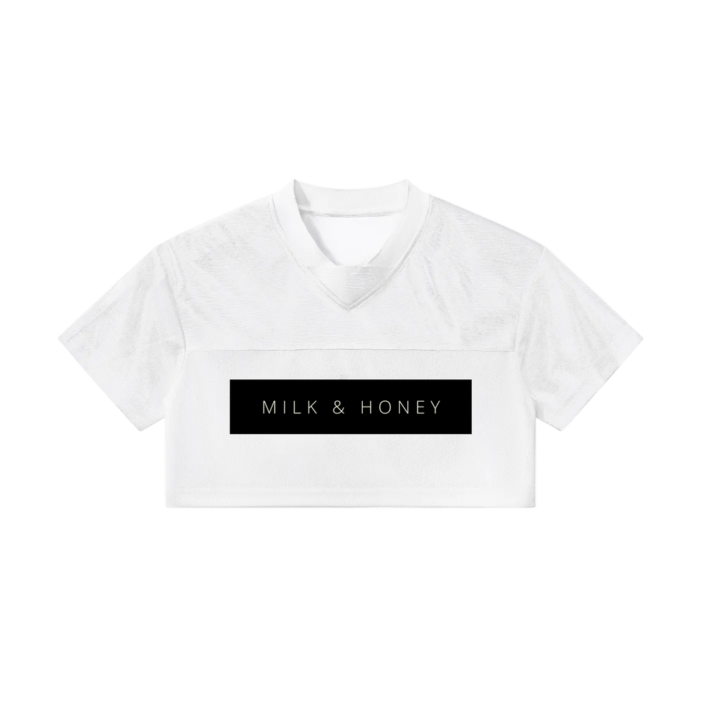 White cropped V-neck short-sleeve top with black rectangular MILK & HONEY chest print