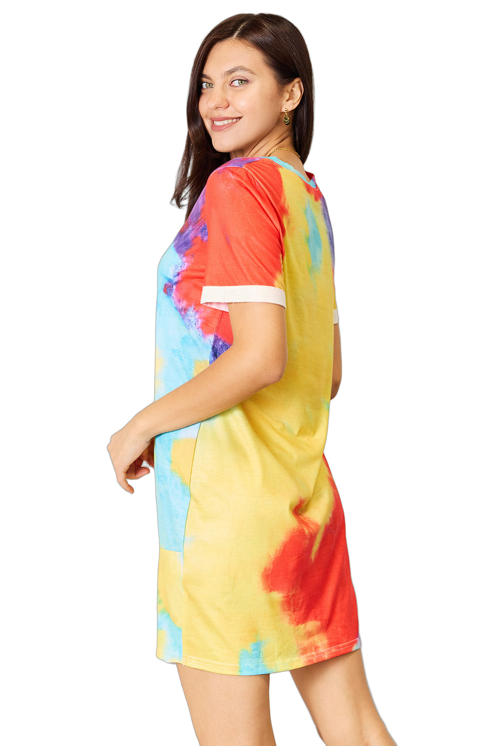 Model smiling over her shoulder wearing a multicolor tie-dye short-sleeve dress with white sleeve cuffs, above-knee length