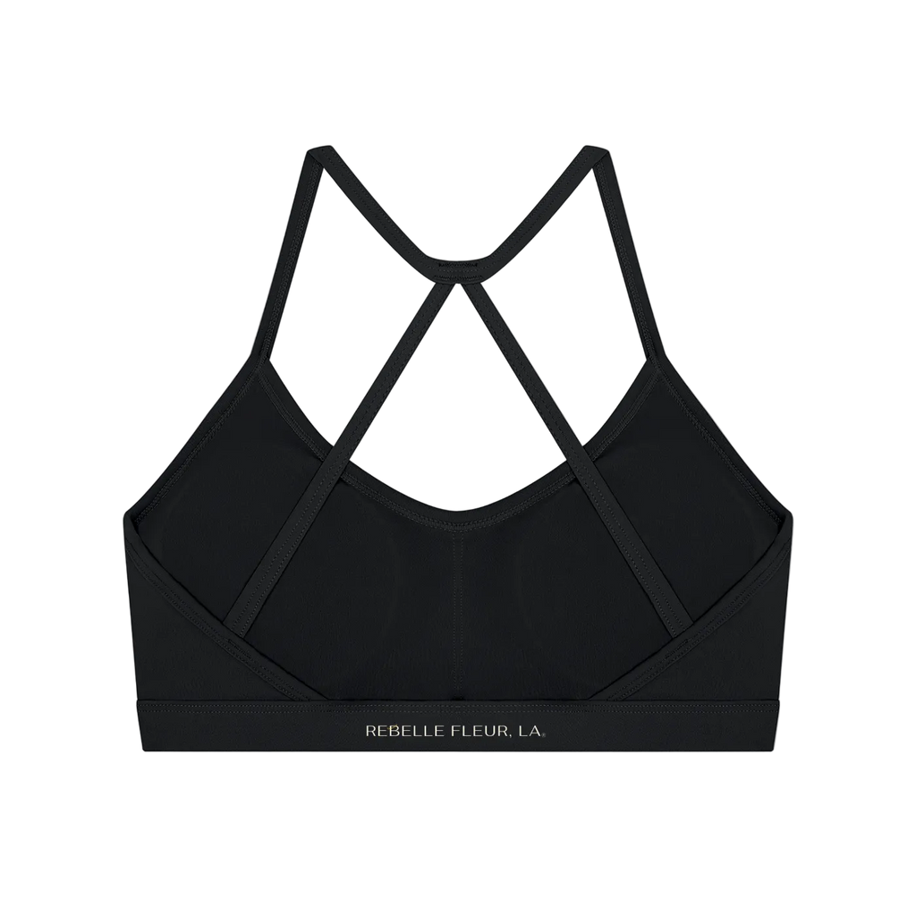 Back of sports bra with thin crisscross straps and elastic underband printed 'REBELLE FLEUR, LA.'