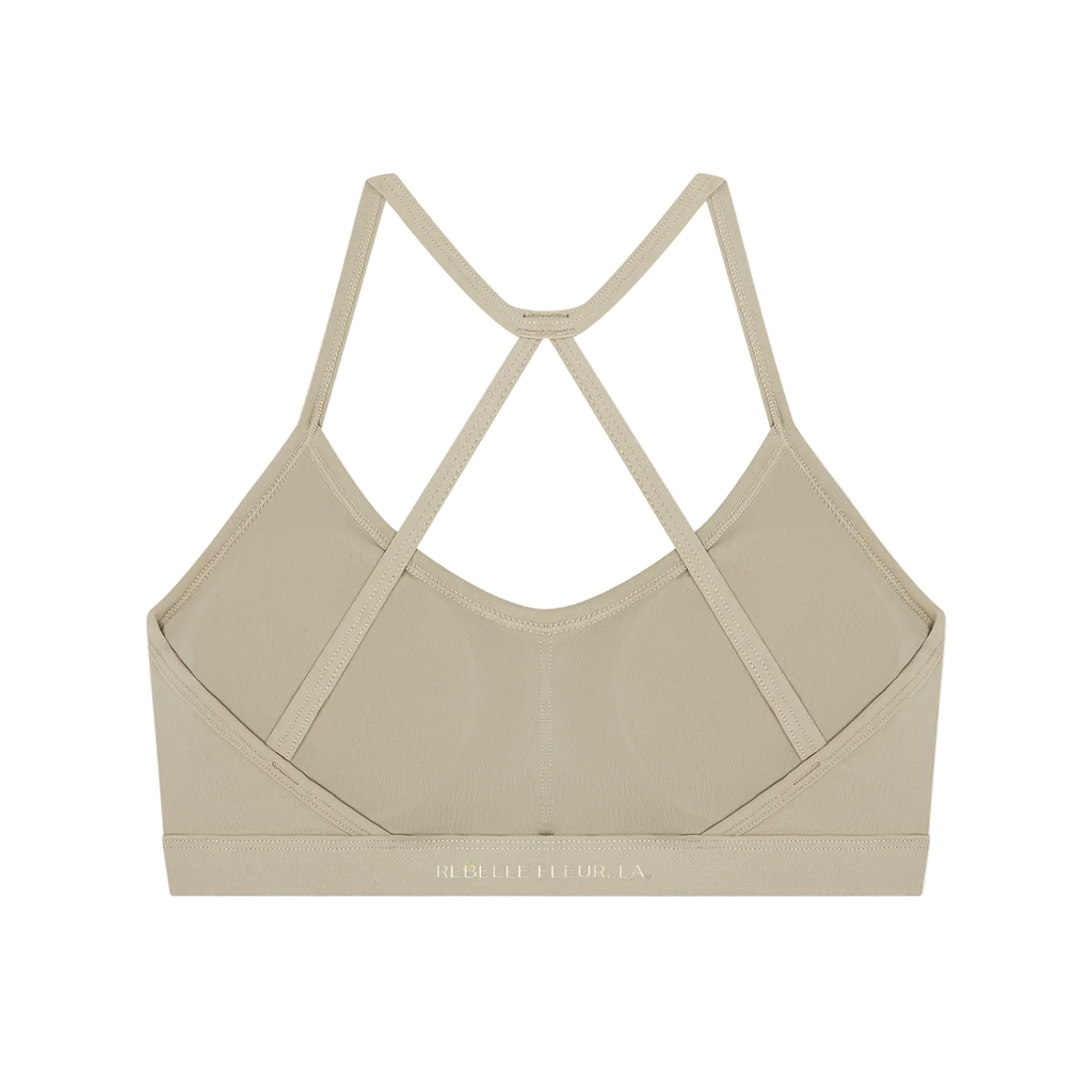 Back of sports bra with thin crisscross straps, scoop back and elastic band showing REBELLE FLEUR LA logo