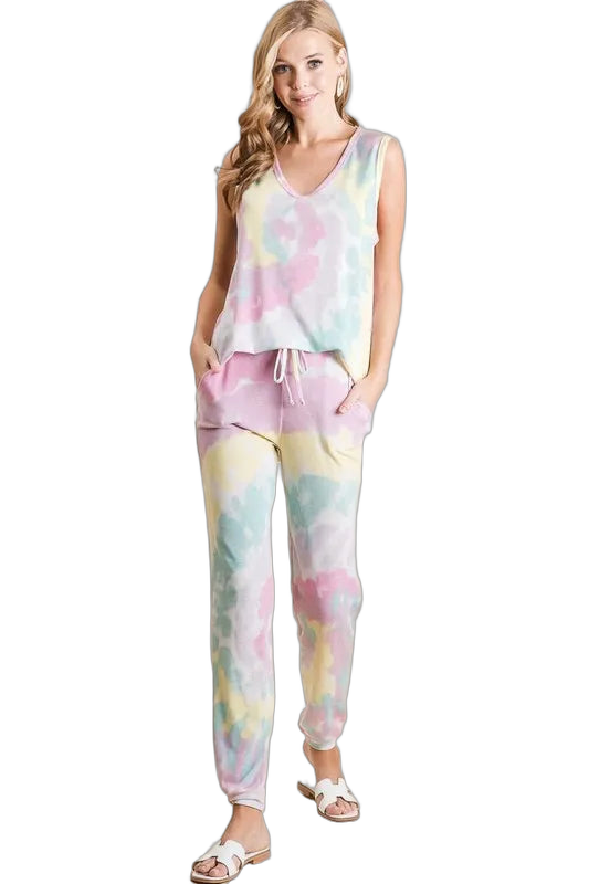 Model wearing pastel tie-dye sleeveless top and matching French terry jogger pants with drawstring and side pockets