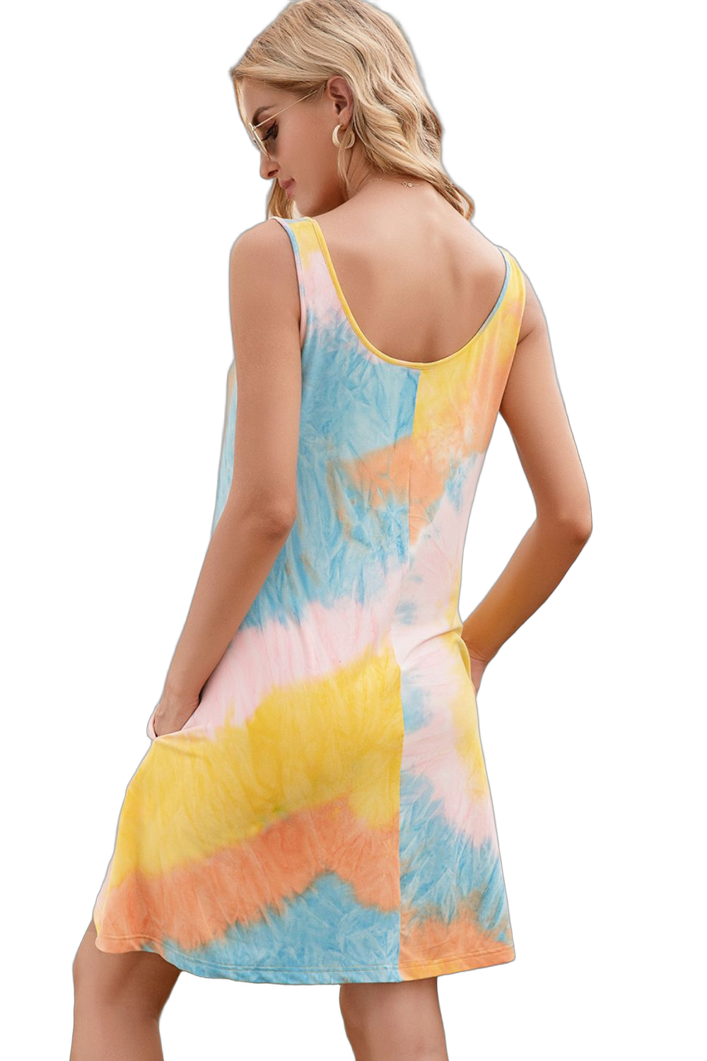 Woman seen from back wearing sleeveless pastel tie-dye mini dress with scoop back and hands in side pockets, wearing hoop…
