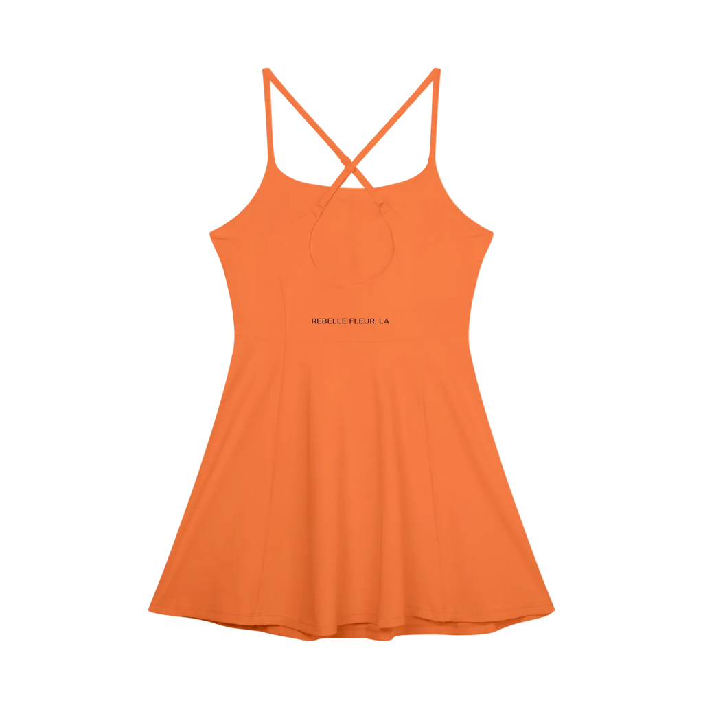 Orange paneled A-line dress with crisscross back straps and 'REBELLE FLEUR, LA' printed at the waist