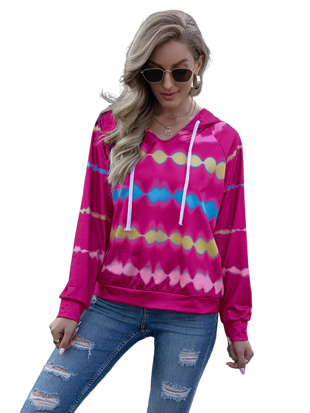 Model wearing hot-pink tie-dye hoodie with white drawstrings, raglan long sleeves, and ripped jeans